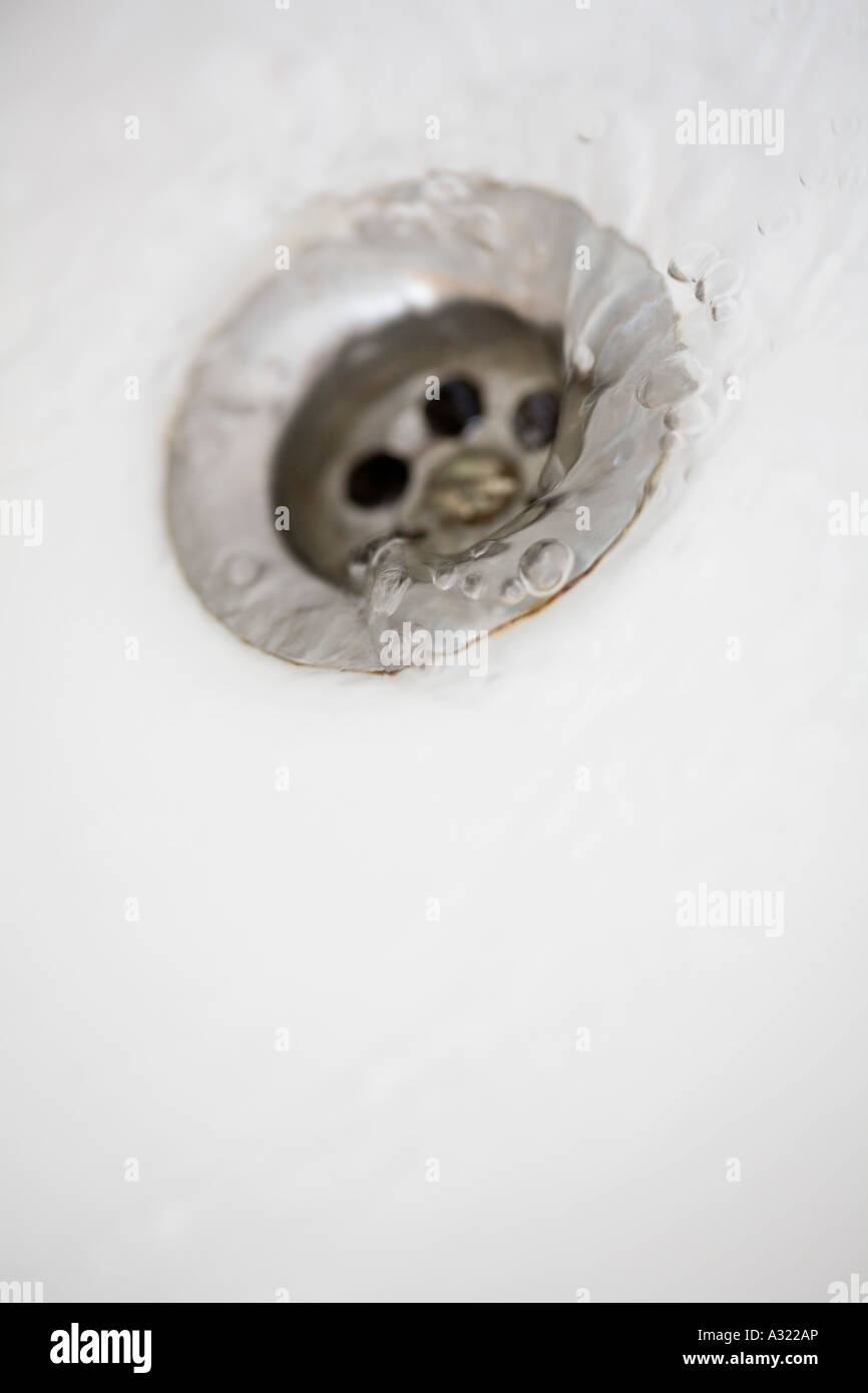 Water running down plug hole Stock Photo