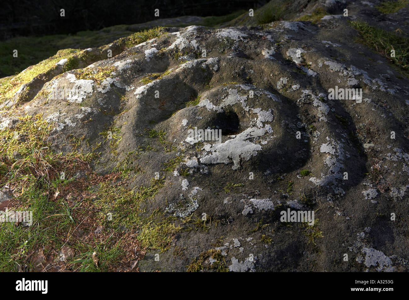 Cup and ring marks Prehistoric rock art Routin Roughting Roughtling Lynn Stock Photo