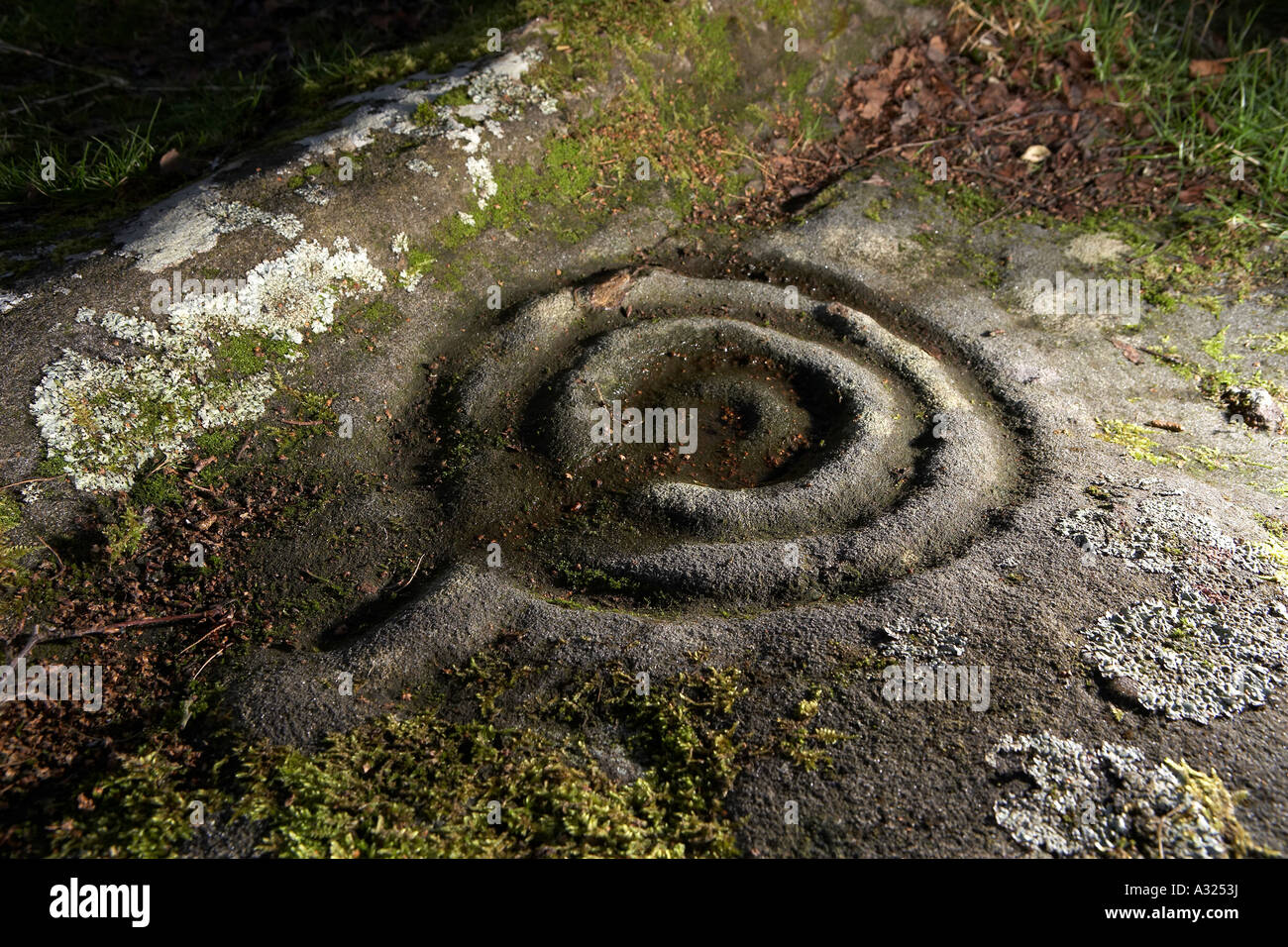 Cup and ring marks Prehistoric rock art Routin Roughting Roughtling Lynn Stock Photo