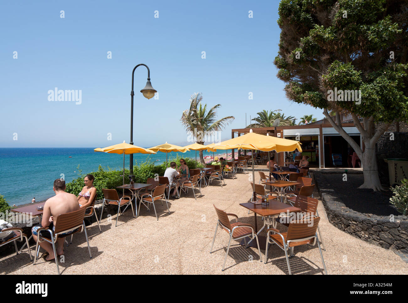 Seafront restaurant on the main beach (Playa Grande), Puerto del Carmen, Lanzarote, Canary Islands, Spain Stock Photo
