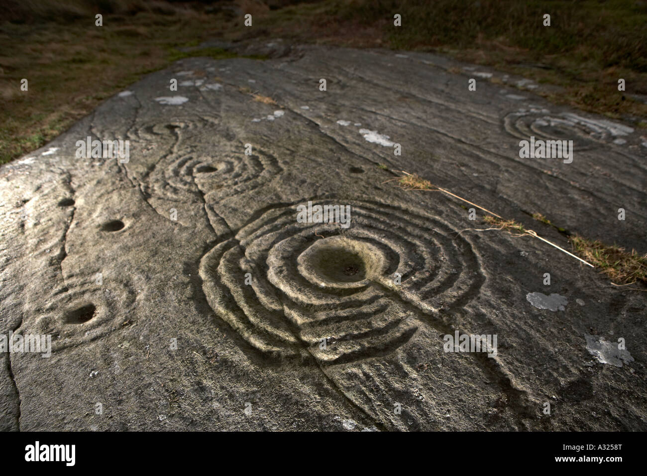 Cup and ring marked rocks Prehistoric rock art Weetwood Moor near Wooler Stock Photo