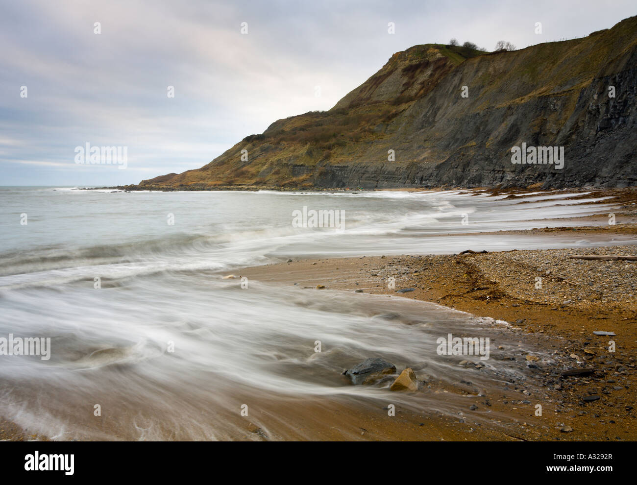Waves wash over the rocks on a stormy afternoon at Chapman s Pool Purbeck Dorest UK Stock Photo
