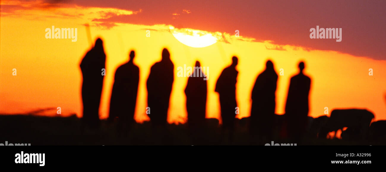 Maasai men at sunrise Kenya Stock Photo