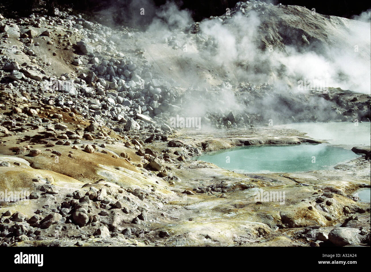 Bumpass Hell Lassen Volcanic showing stones boulders sulphuric acidic mist California United States of America USA Stock Photo