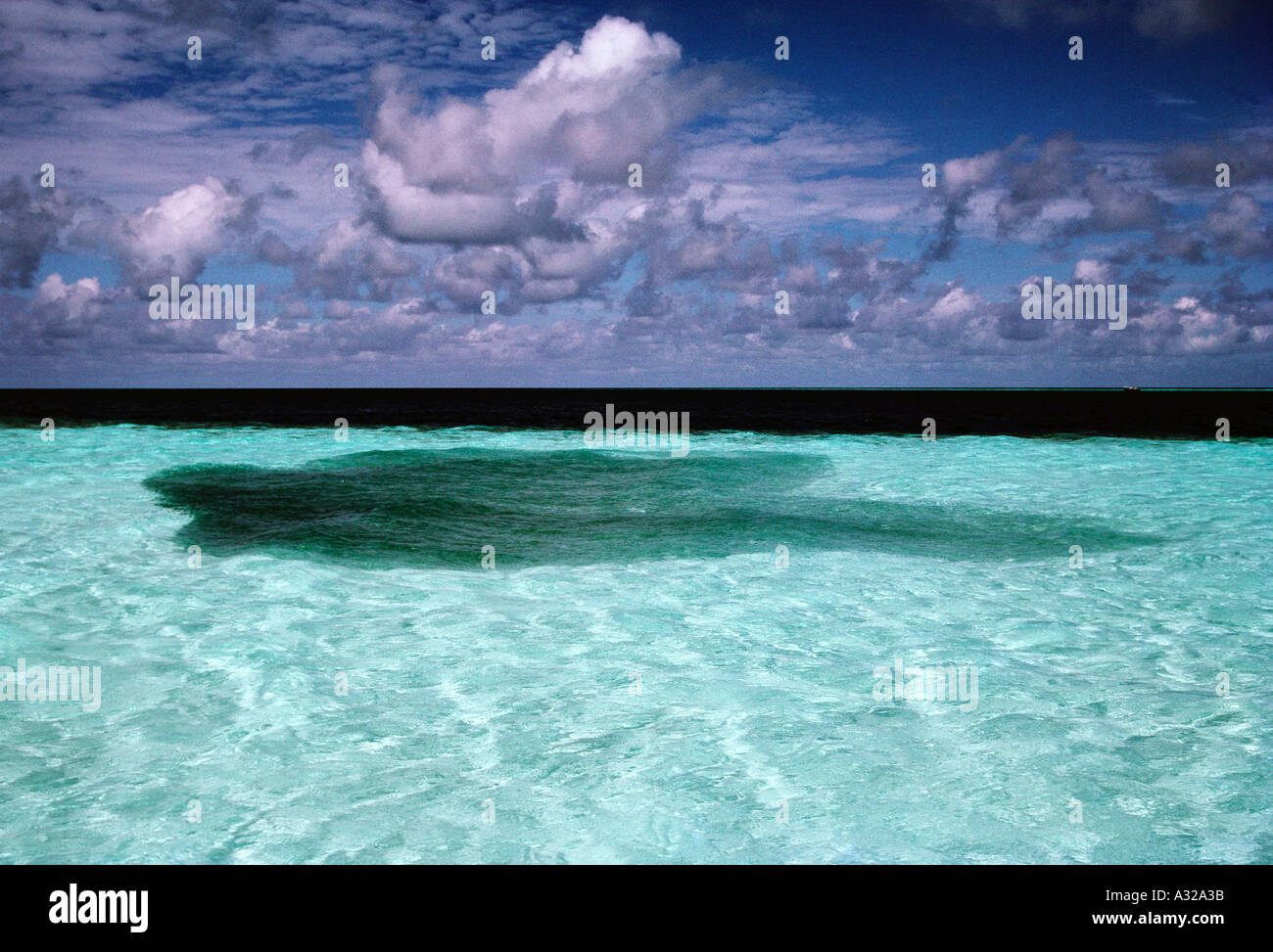 Cloud reflection in sea, Biyaadhoo island, Biyadhoo island, Biyadoo Island, Male, Maldives Stock Photo