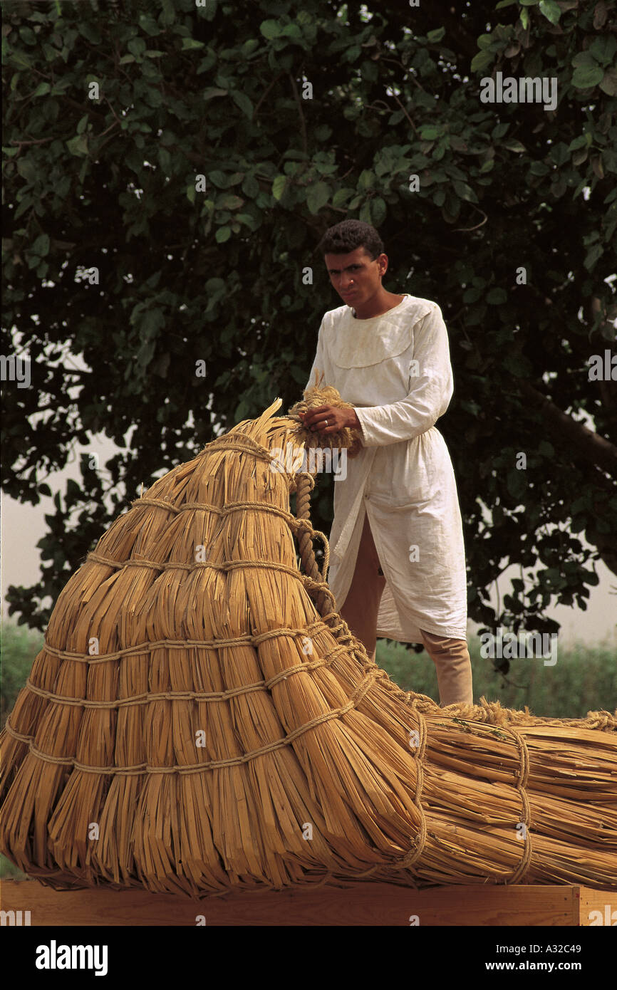 Man weaving a papyrus reed boat as used in Pharaonic times in ancient