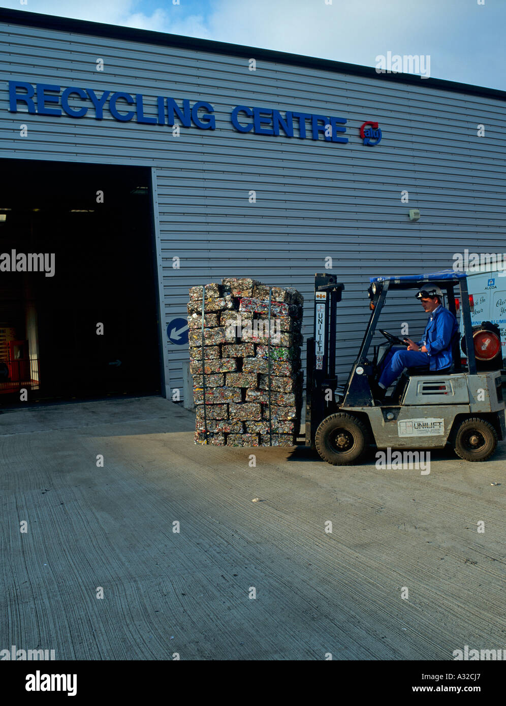 Moving crushed cans into recycling centre industrial estate Swansea West Wales Stock