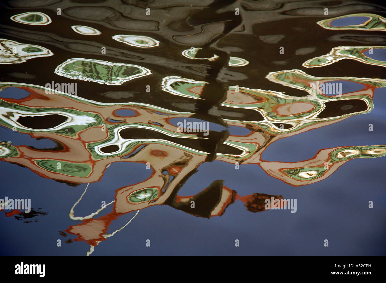 Reflections in the water of a canal creating and abstract image Stock ...