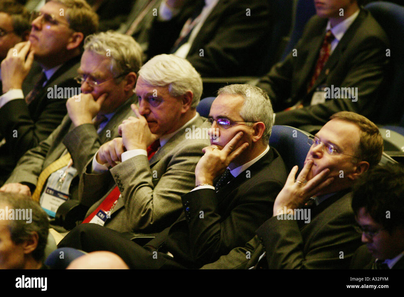Businessmen listen to a speech at the CBI conference at the International Convention Centre in Birmingham UK Stock Photo