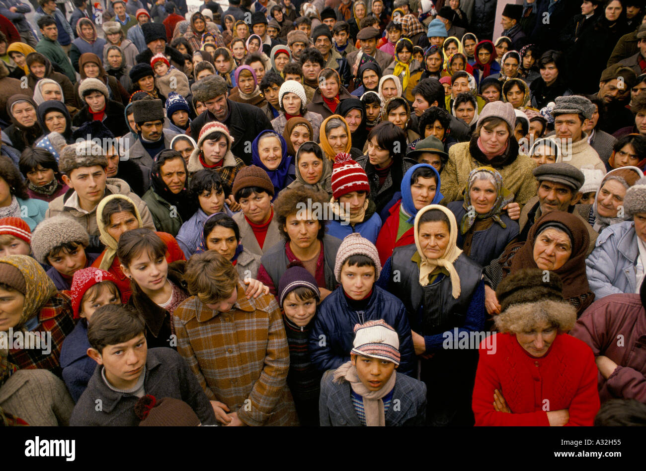 Romania after the revolution. Crowd of people of all ages waiting for food aid Transylvania Stock Photo