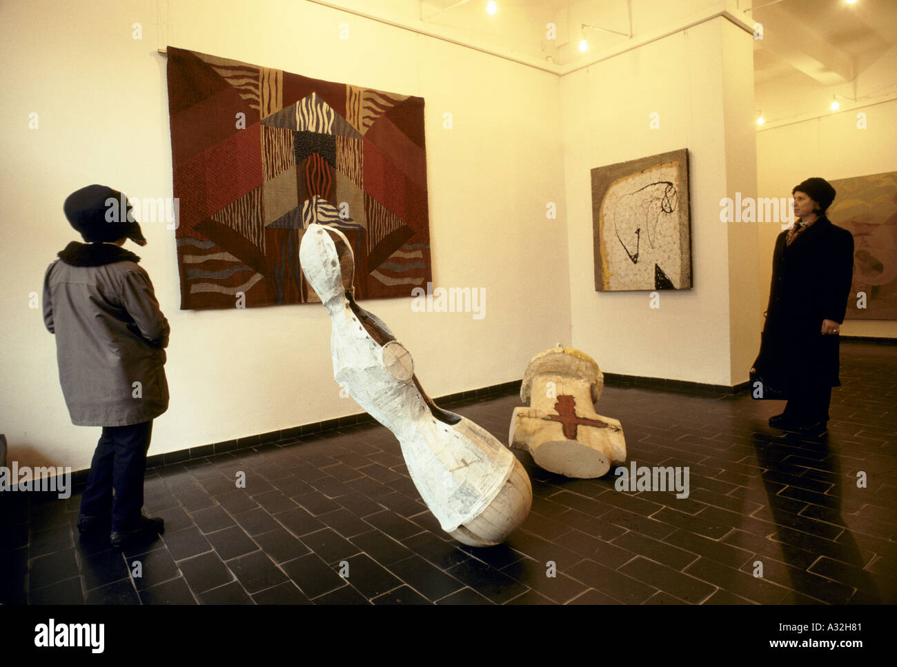 romania after the revolution visitors viewing paintings sculptures in ...