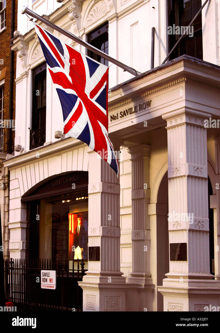 Union jack flying outside tailor's shop in Savile Row, london, england Stock Photo