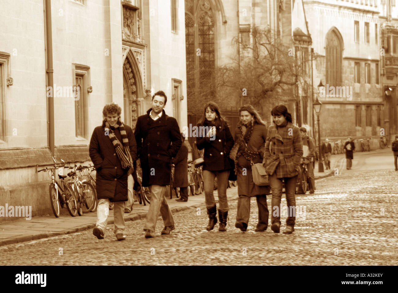 Students walking past Merton Chapel, Merton College Oxford. Stock Photo