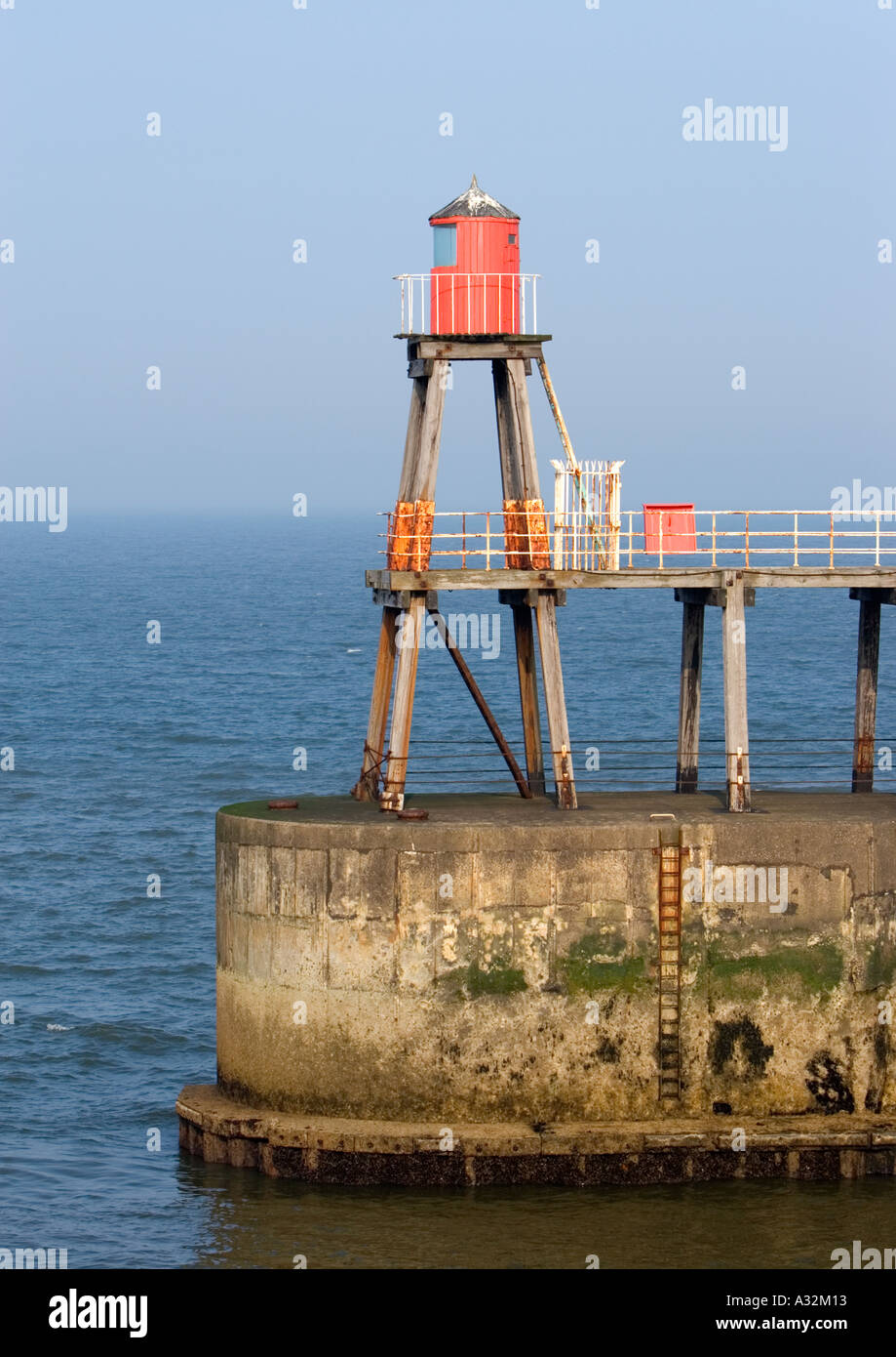 Red wooden beacon on east pier whitby north yorkshire england uk Stock