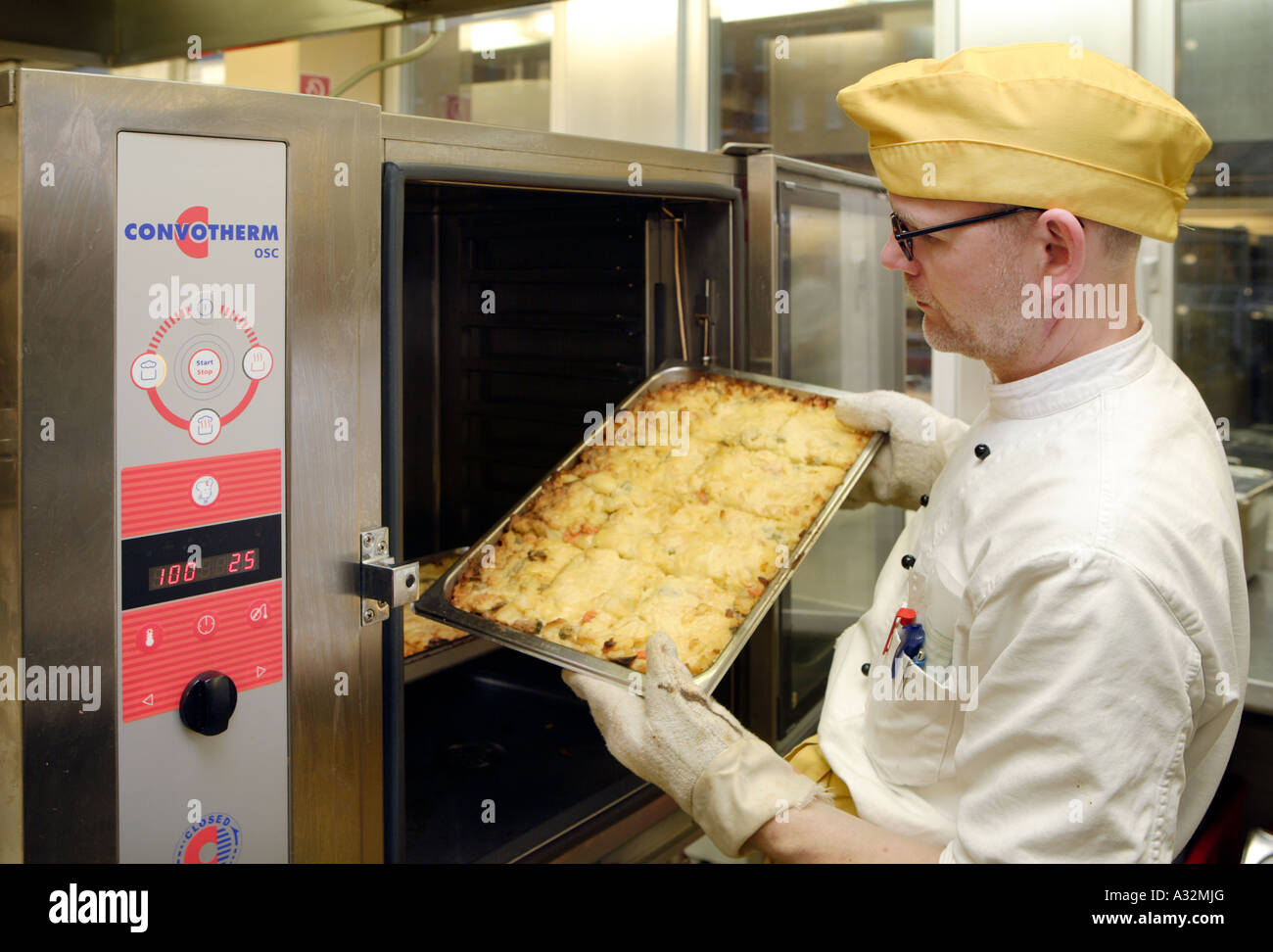 The cook and the chef de cuisine in his canteen kitchen Stock Photo - Alamy