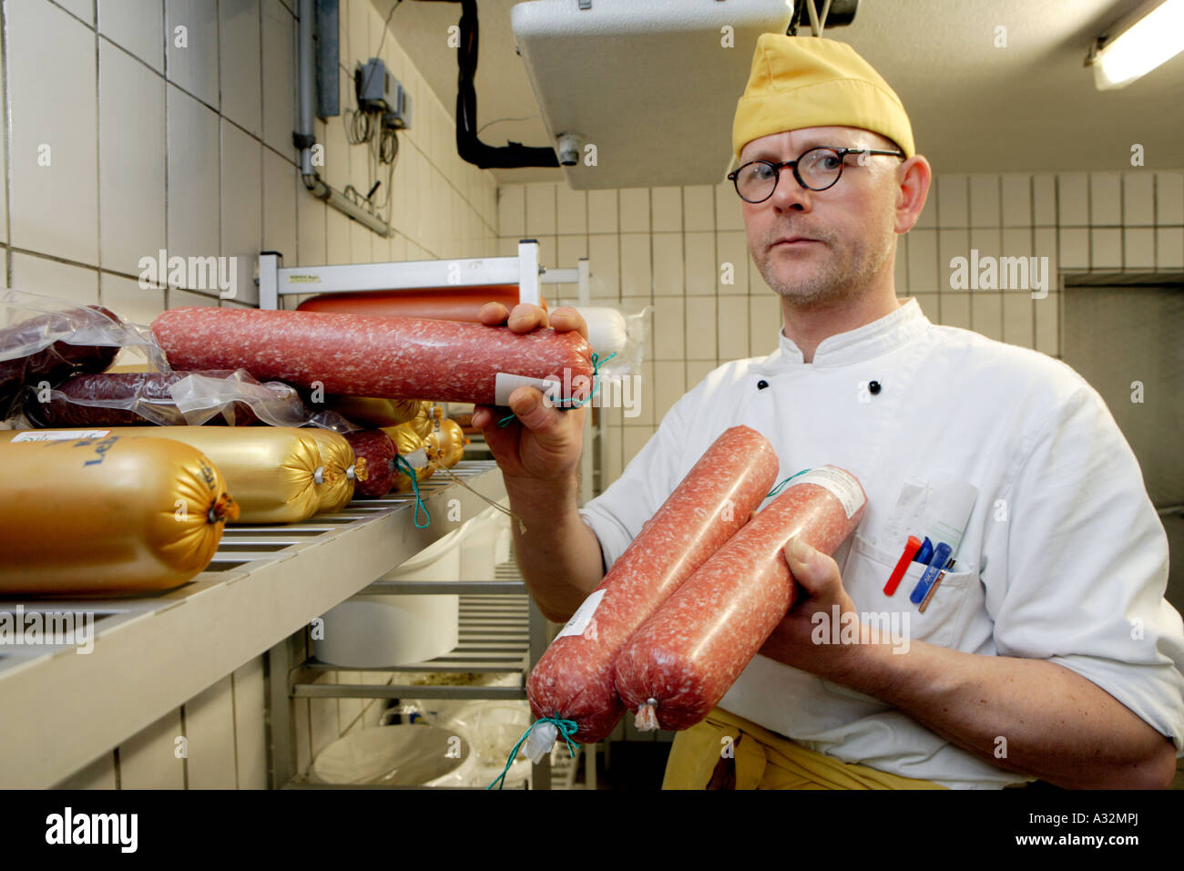 The cook Stefan Voege in the coldroom Stock Photo