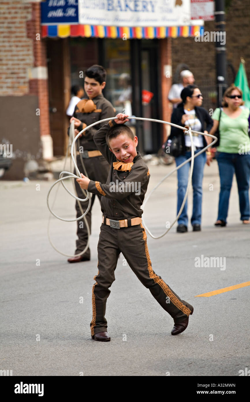 ILLINOIS Chicago Young boy in costume twirl lariat in Mexican