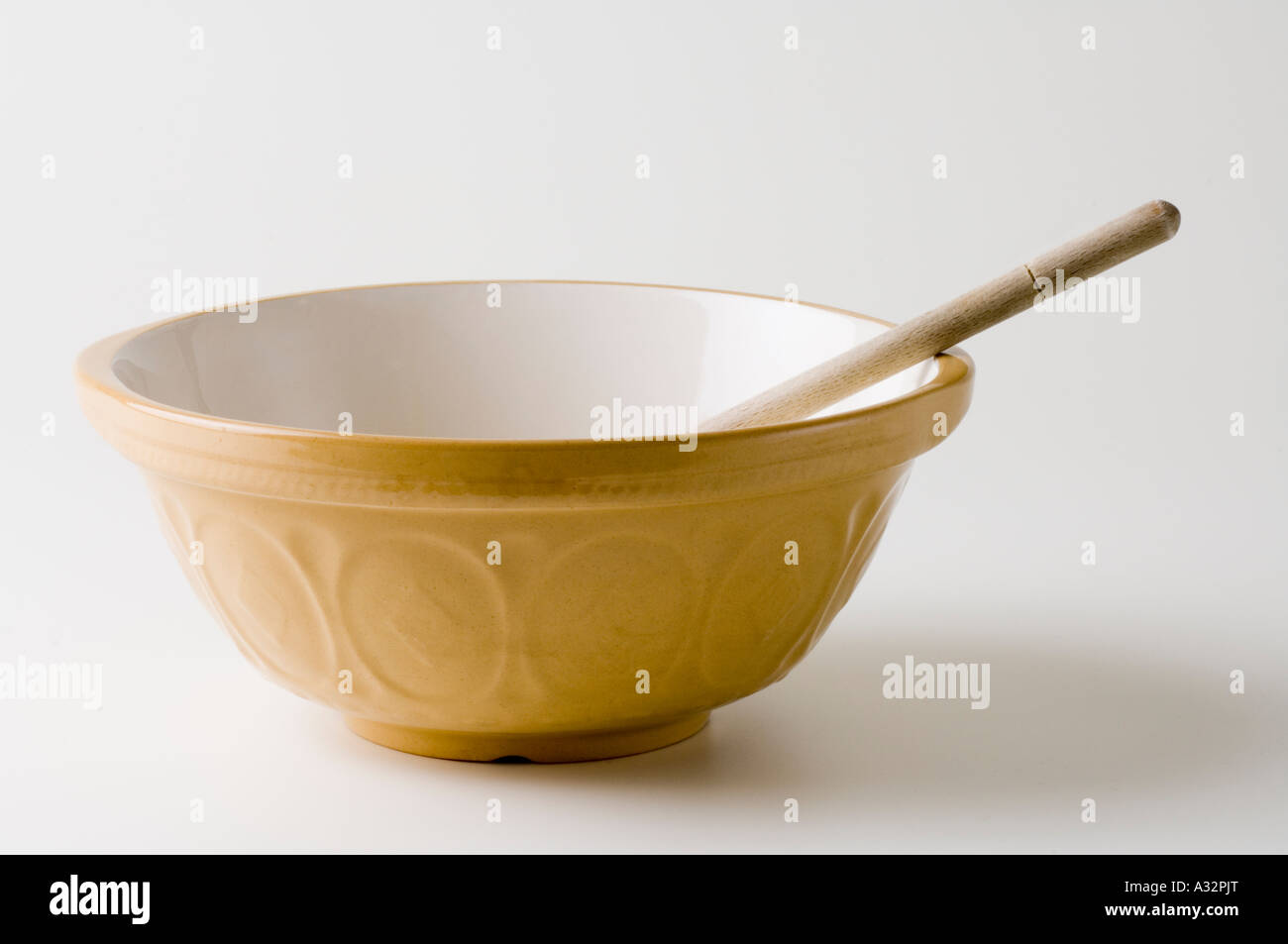 Empty Mixing Bowl With Wooden Spoon Stock Photo