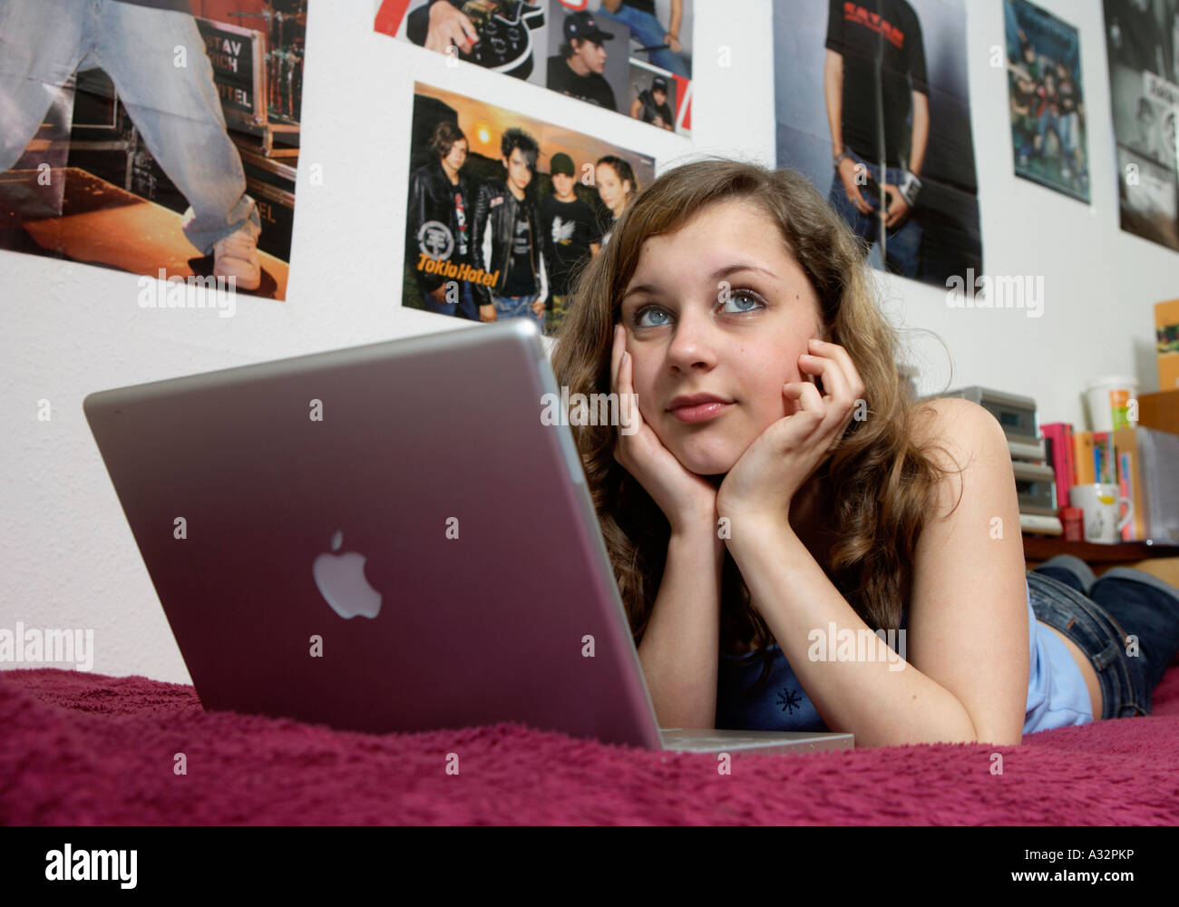 Teenage girl in her room, working on her laptop Stock Photo - Alamy