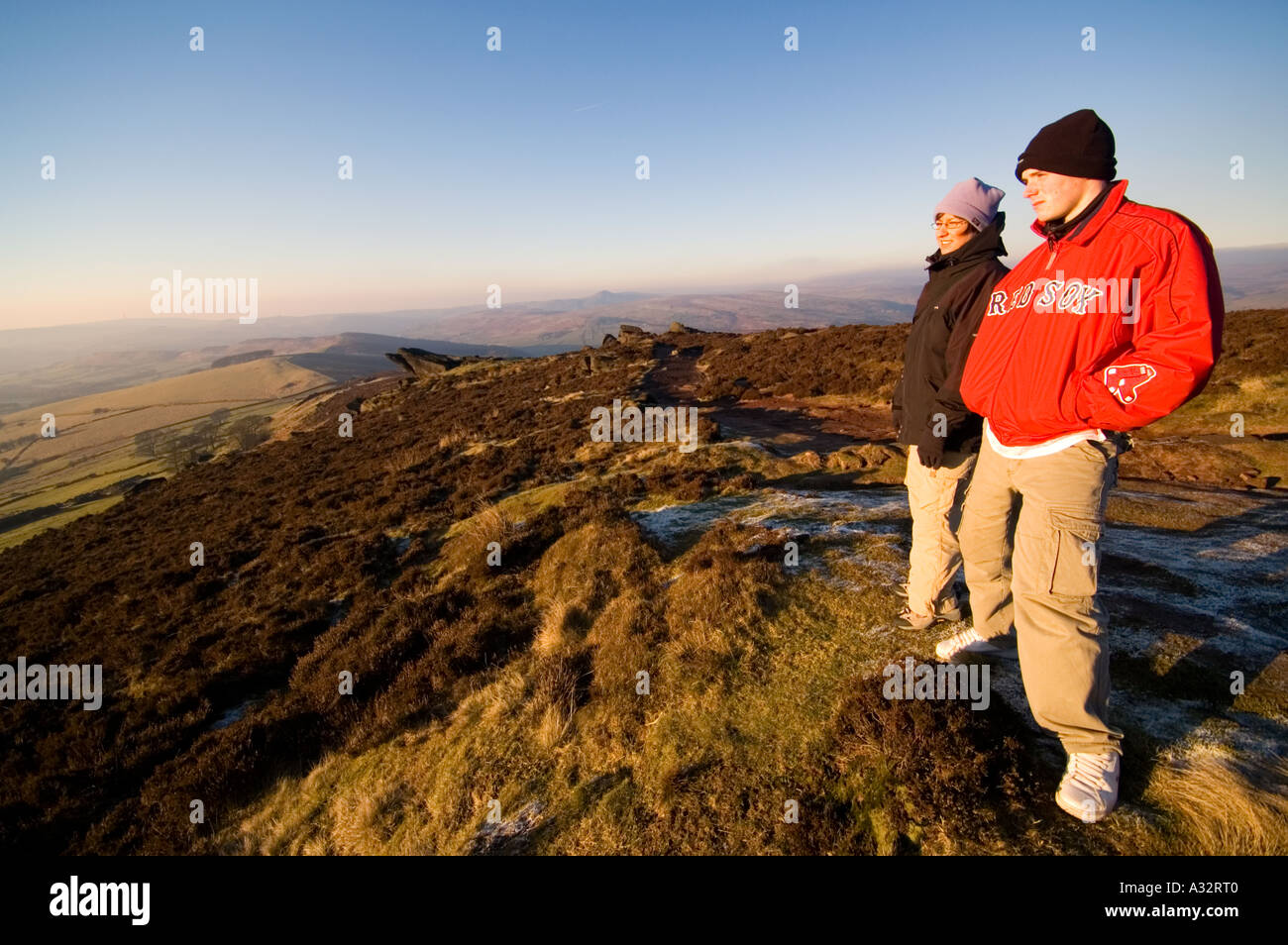 Girl and Teenage Boy Look out Across The Cheshire Plains Staffordshire UK Stock Photo