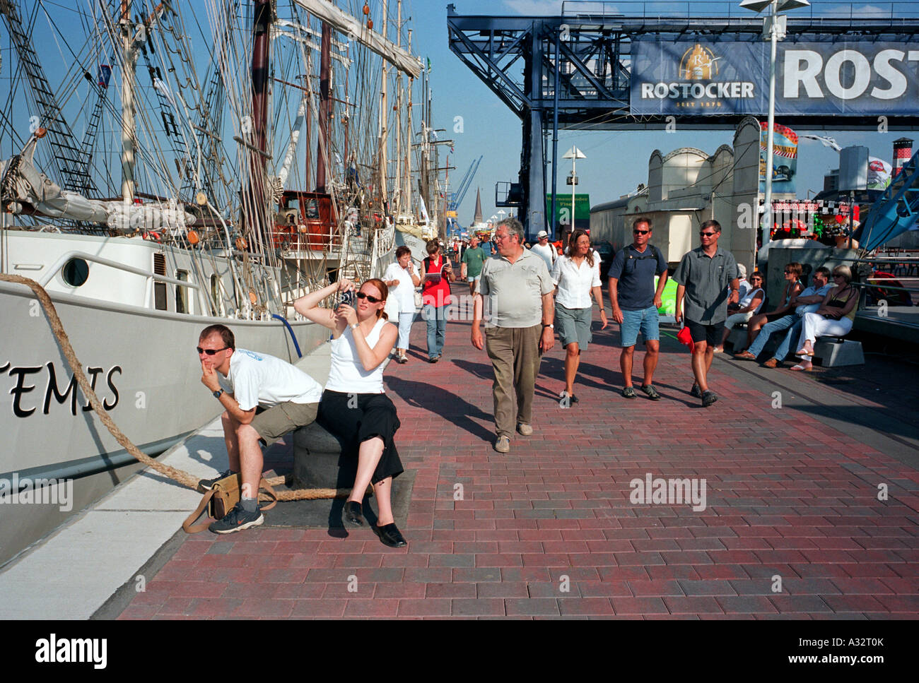 People on a harbour promenade, Rostock, Germany Stock Photo