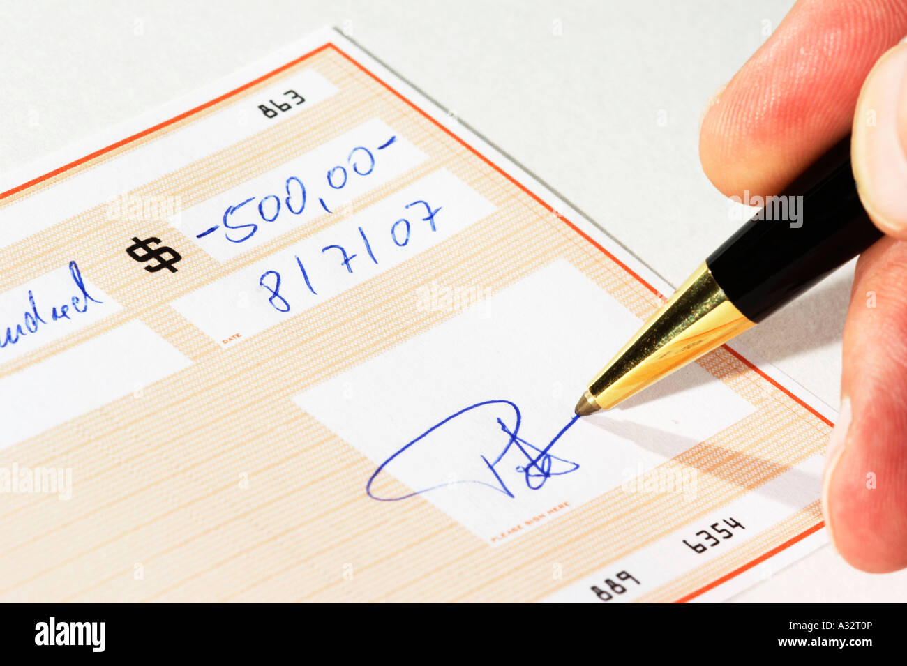 Writing a bank check Stock Photo Alamy