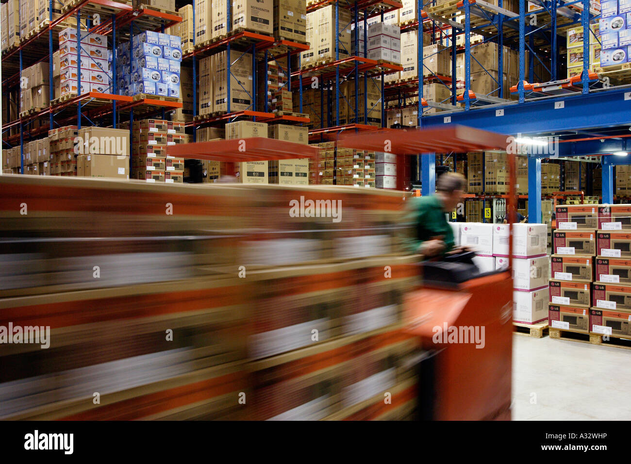 Warehouseman operating a forklift in a high rack warehouse, Willich, Germany Stock Photo