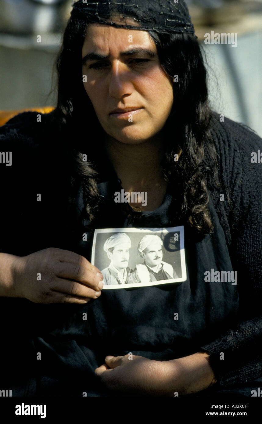 A tearful Barzani Widow from Qosh Tapa, holds a photograph of male relatives taken from their homes during the Anfa campaign. Stock Photo