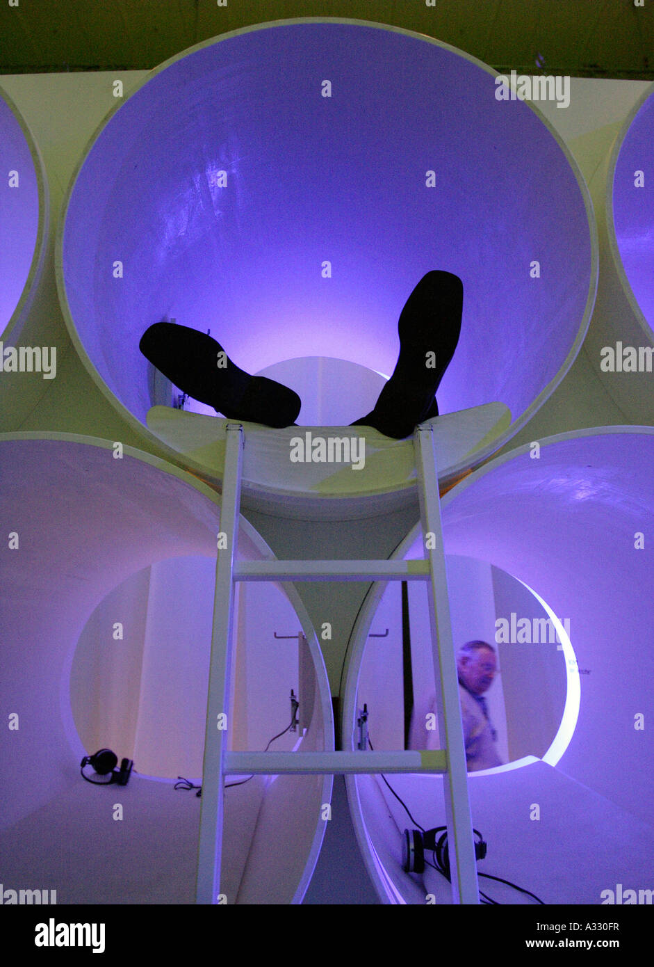 Man resting in a chillout zone at the Internationals Radio And Television Exhibition in Berlin, Germany Stock Photo