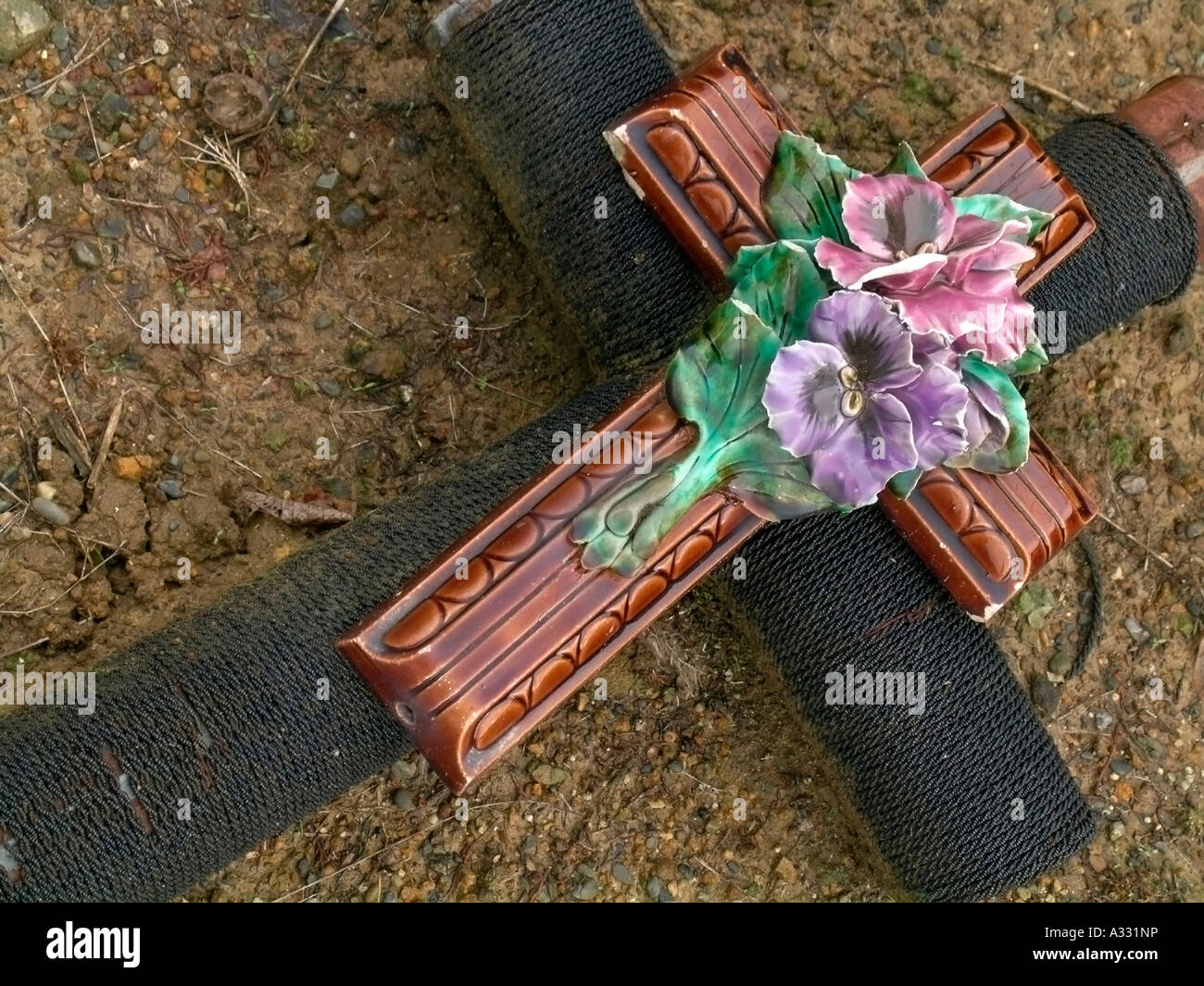old grave cross with ceramic flowers on a grave in an old cemetery graveyard Stock Photo Alamy