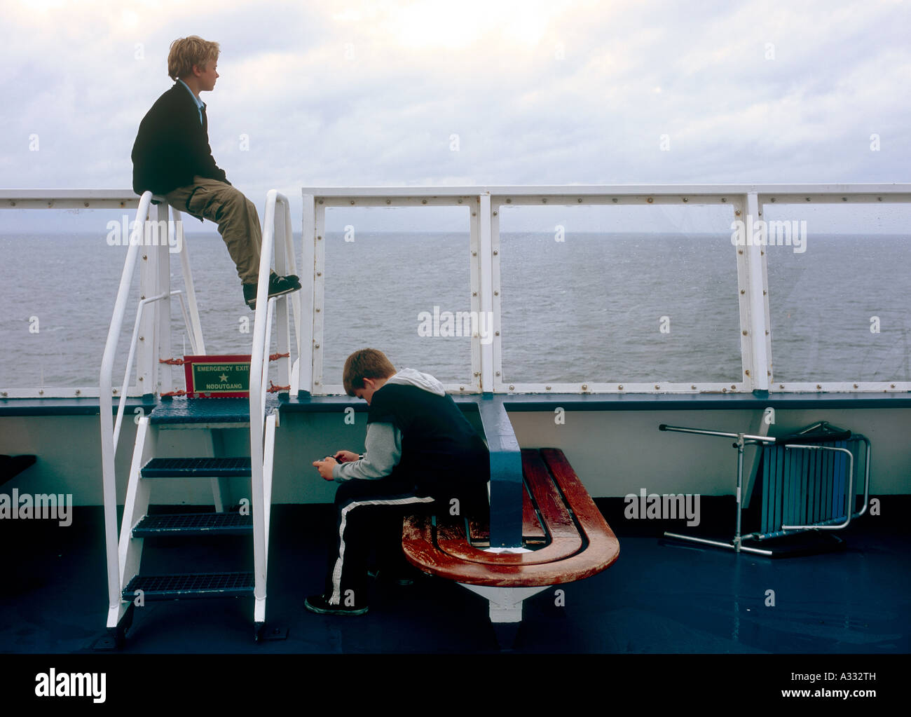 Two young boys on a ferry ship of the Reederei Color Line Stock Photo