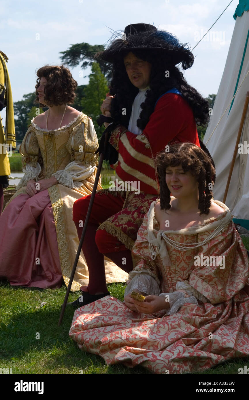 Actors playing King Charles II his sister and Nell Gwynne at a ...