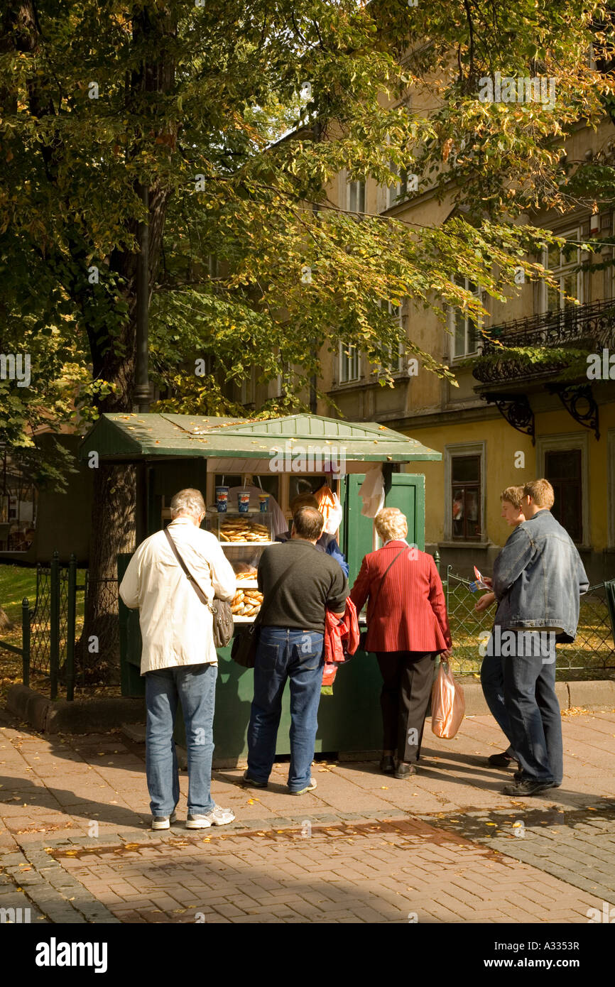 People waiting at a fast food kiosk in the Planty, Cracow, Poland. Stock Photo