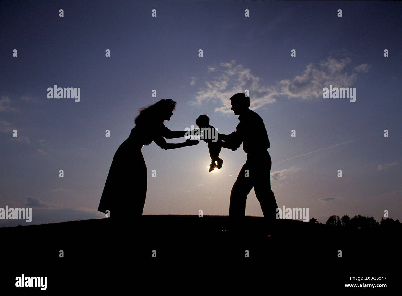 Silhouette of parents and baby MR1 6E4 Stock Photo