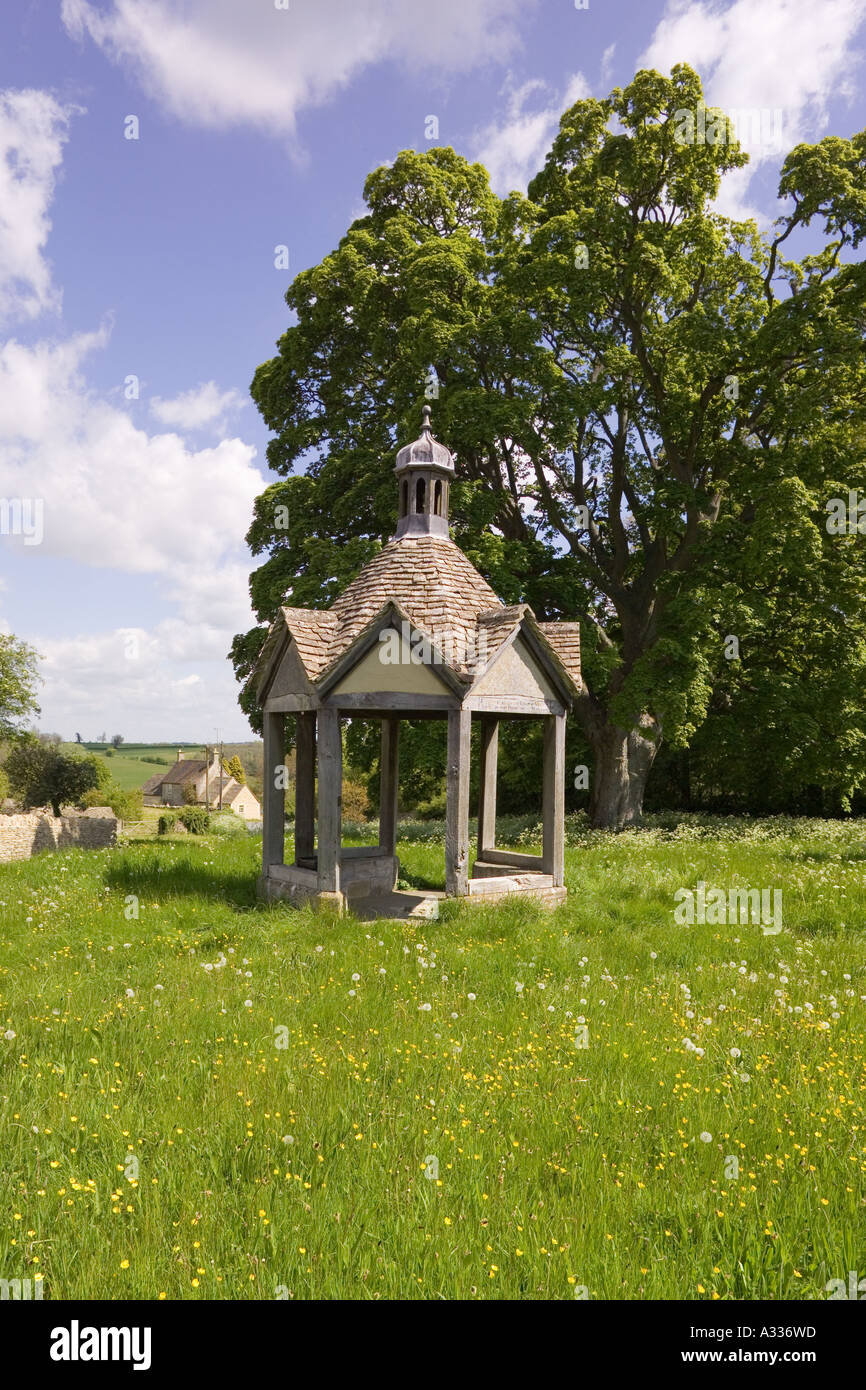 1874 pumphouse on the village green of the Cotswold village of