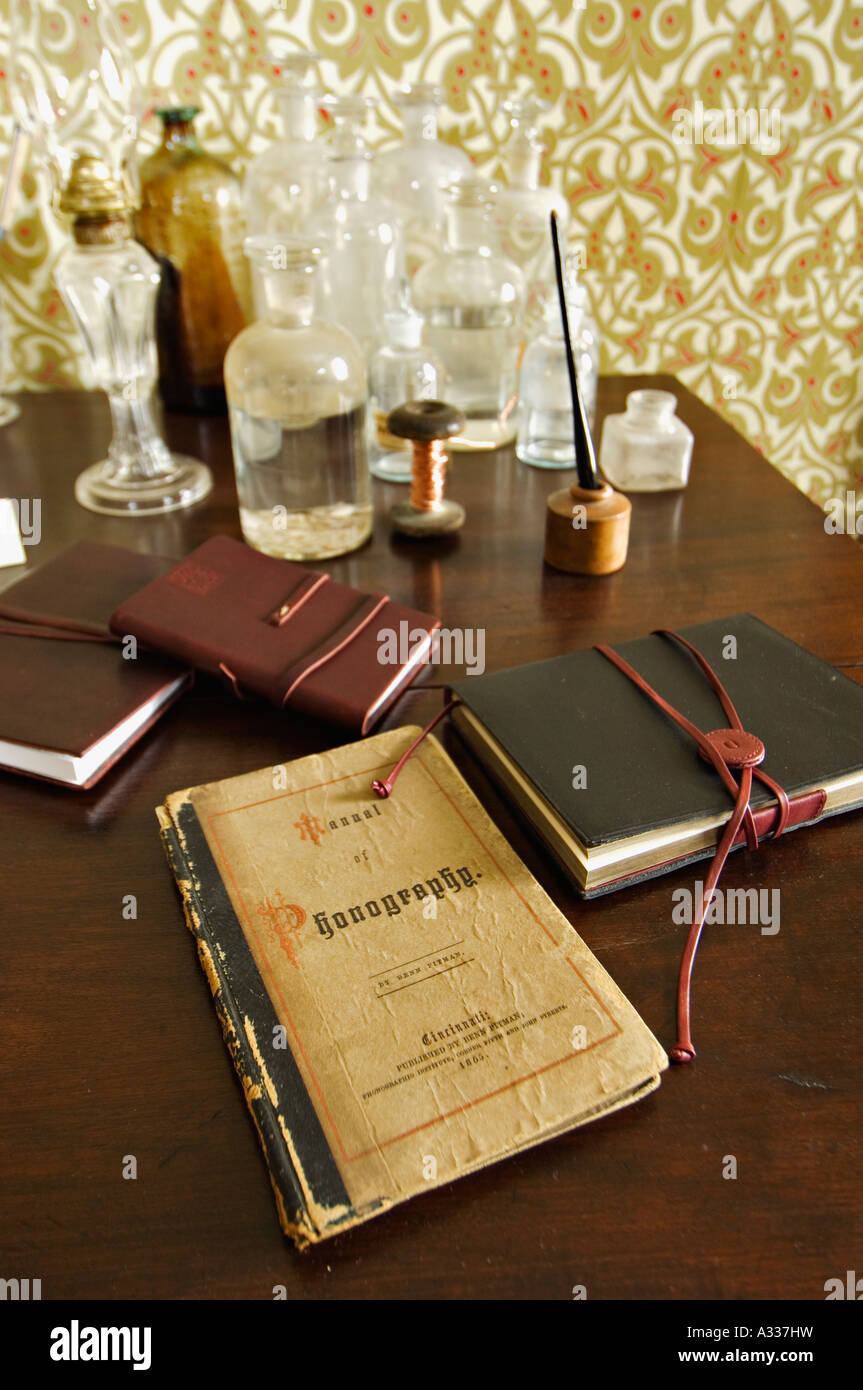 Old Phonography Book Journals Chemical Bottles Copper Wire and Pen on Desk Thomas Edison House Louisville Kentucky Stock Photo