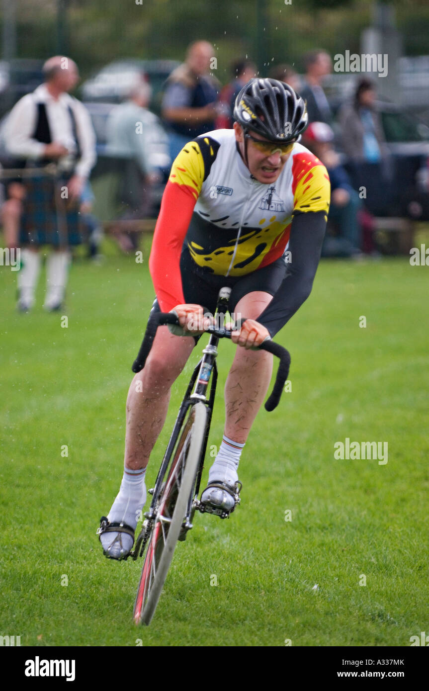 Bicyclist Surrounded by Midges Racing in Glenurquhart Highland Gathering and Games Drumnadrochit Stock Photo