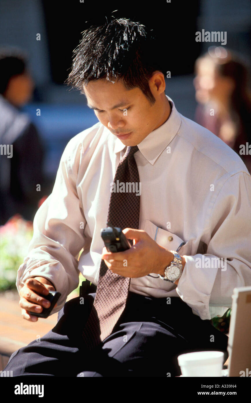 Asian man with pager 56A Stock Photo
