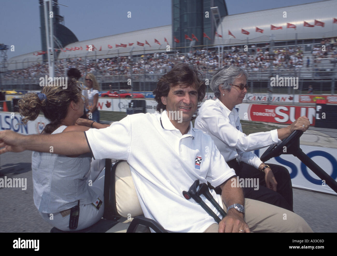 Alex Zanardi waves to fans at his visit to the Molson Indy Toronto 2002 Stock Photo