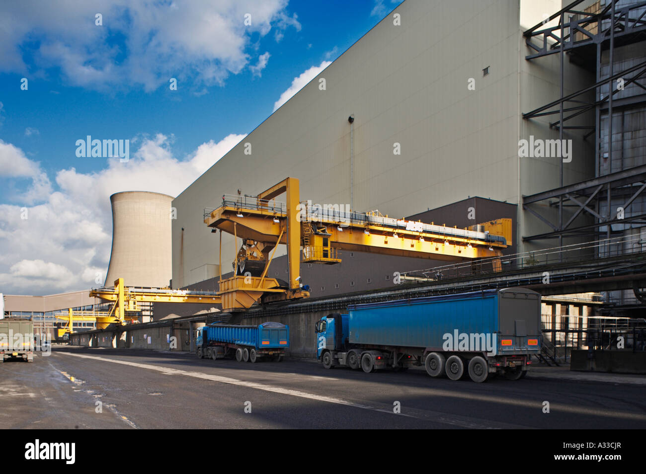 Lorries being filled with waste washed ash from a coal fired power station, UK Stock Photo
