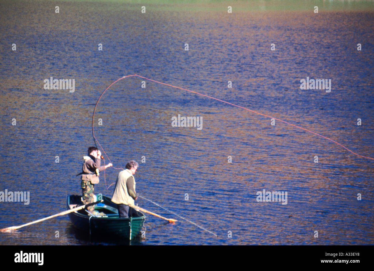 Anglers fly fishing on Watendlath Tarn Cumbria Stock Photo