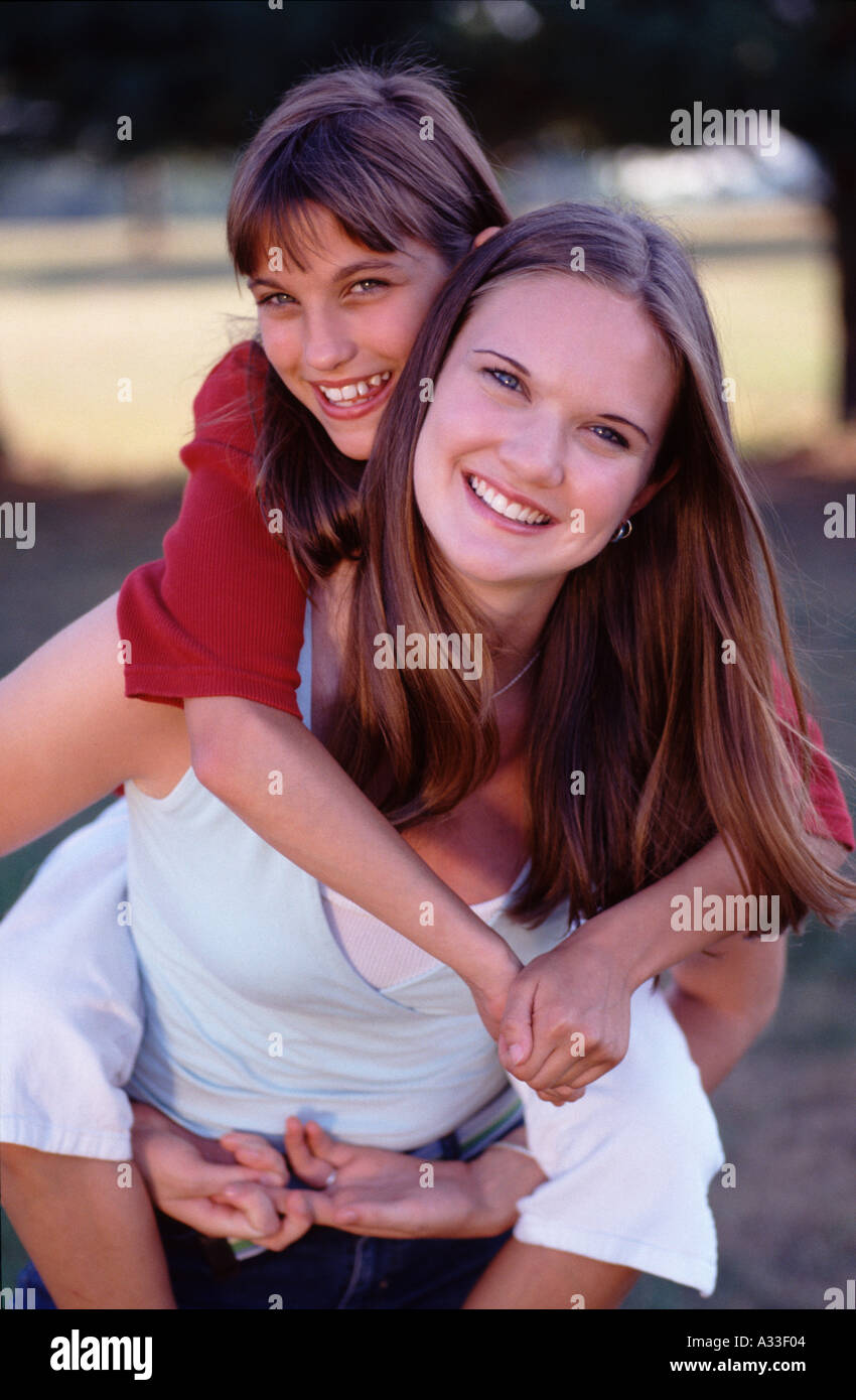 Boy Giving Piggyback Ride To Twin Sister Stock Photo - Image of game,  friend: 233593328