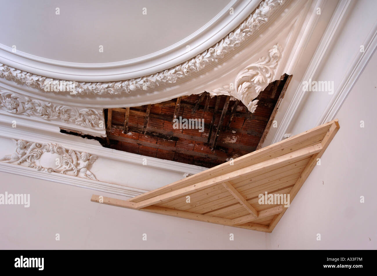 A Wooden Shelf Built In Preperation For Repair Work Beneath