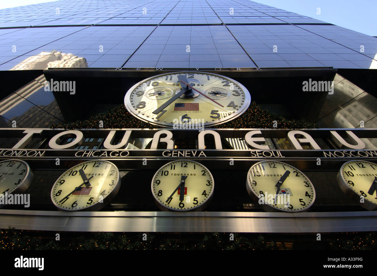 Clocks giving the time in various countries outside Americas largest watch store the Torneau shop in New York city Stock Photo