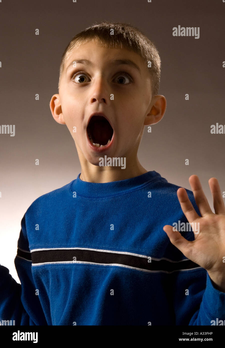 Informal portrait setting of a 6 year old child making faces for the