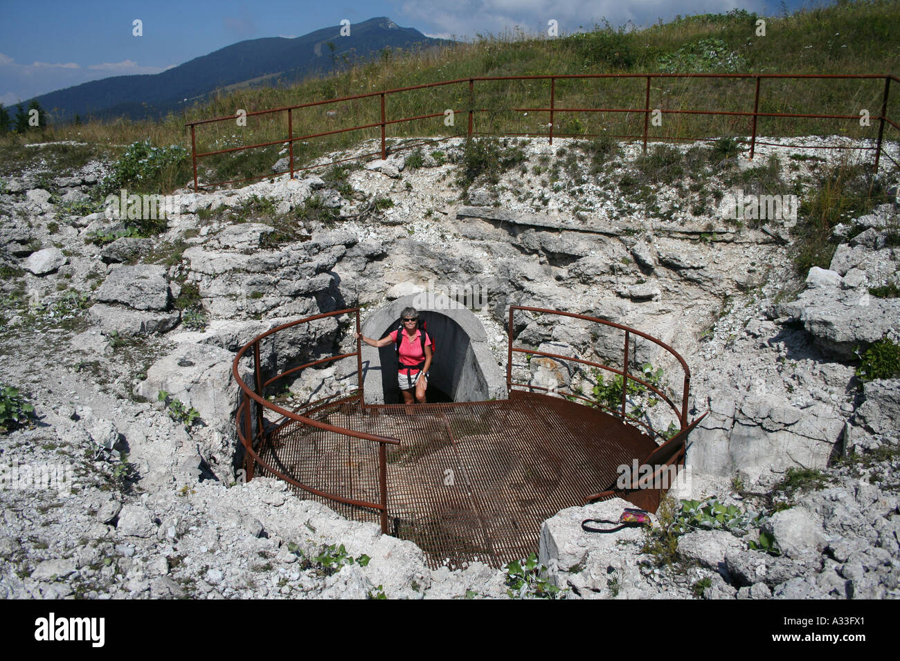 Walker exploring ruined first world war Forte Cherle on the Folgaria altopiano, Trentino Veneto, Italy Stock Photo