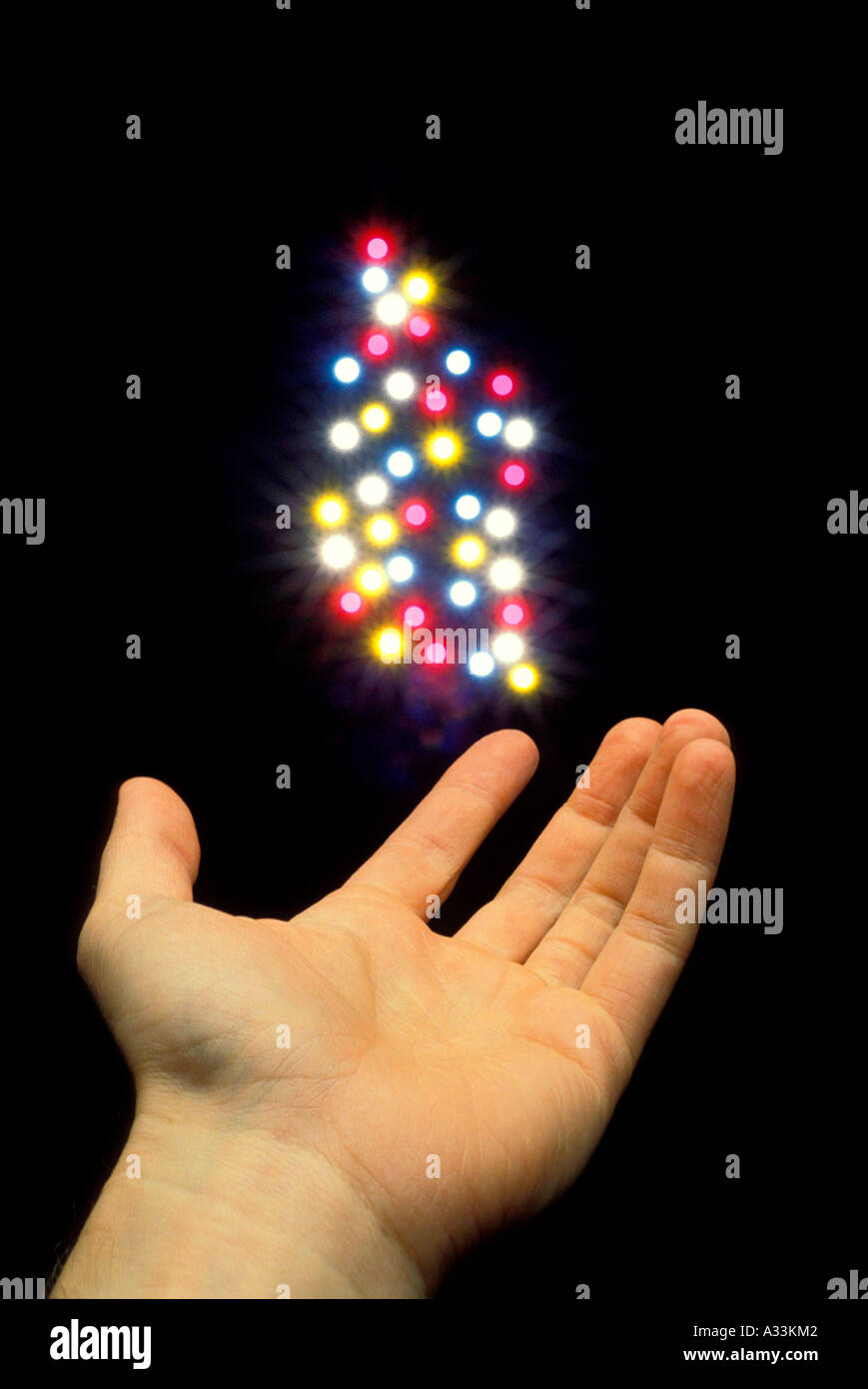 Hand conjures magic light 18F Stock Photo - Alamy