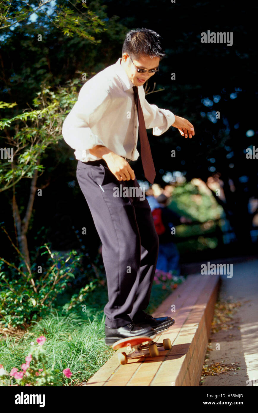 Skateboarding businessman 5C2 Stock Photo