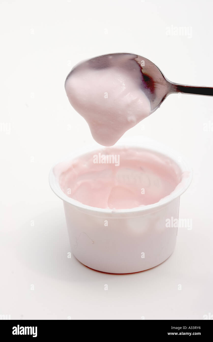 spoonful of strawberry yogurt Stock Photo Alamy