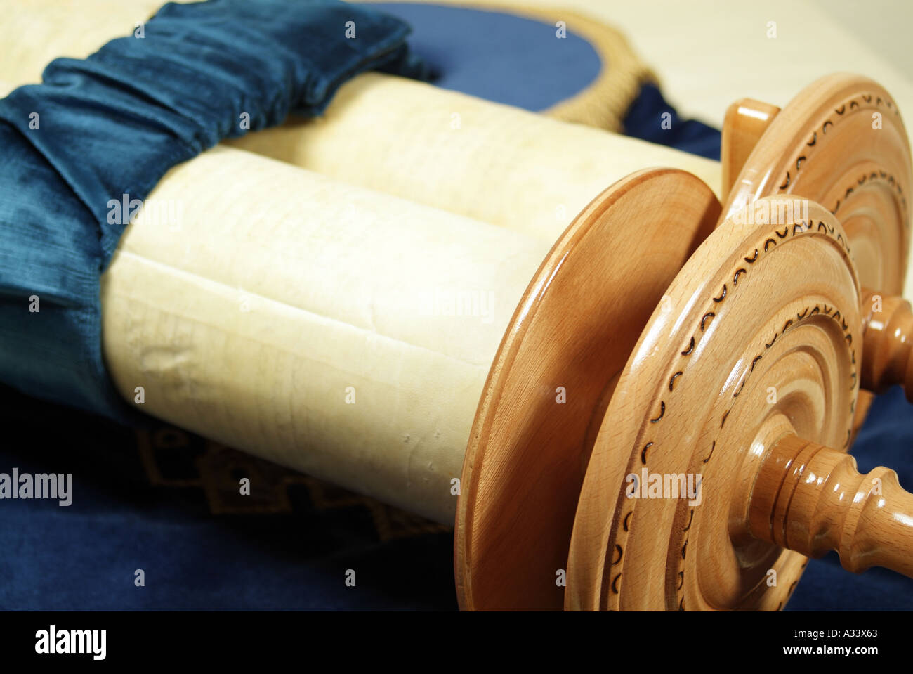 Closed Torah scroll showing wooden rollers Stock Photo